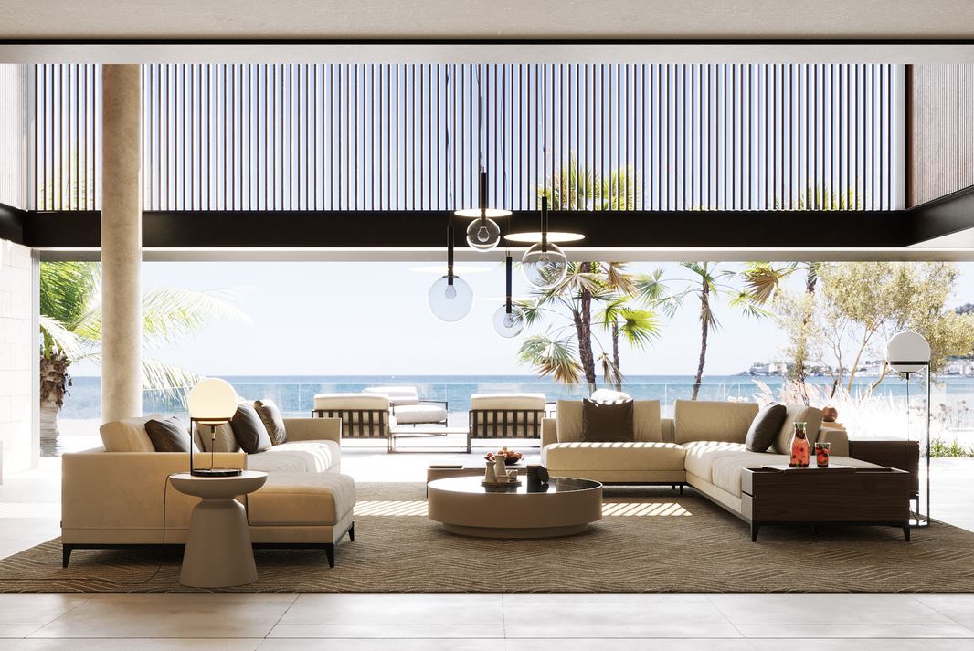 Big living room with two modular sofas and a beach view