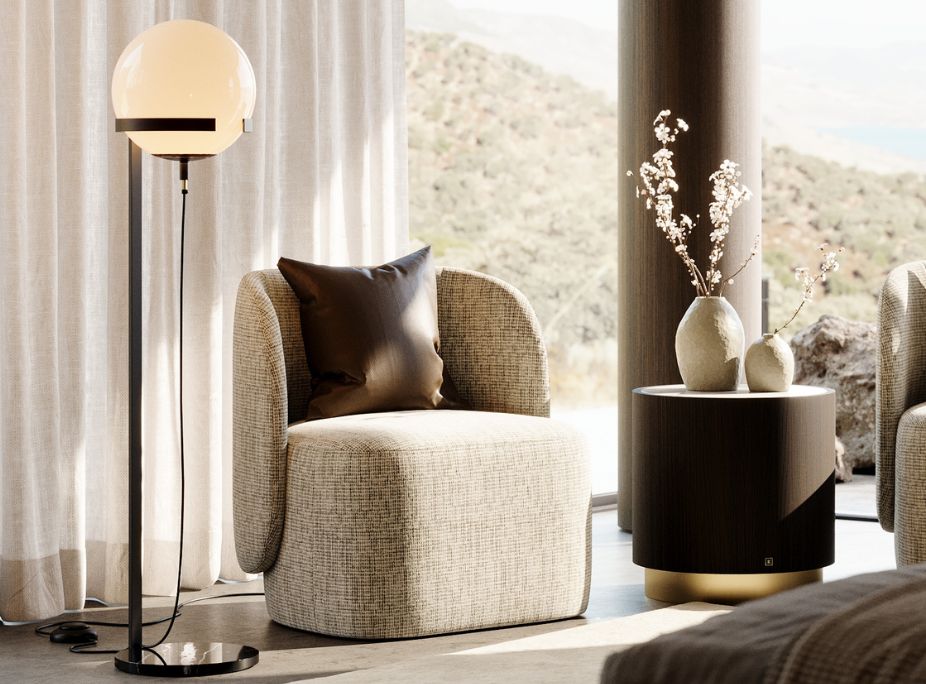 Floor lamp, upholstered armchair, dark wood side table, abundant lateral light in a neutral interior. An example of how different light sources affect the perceived textures.