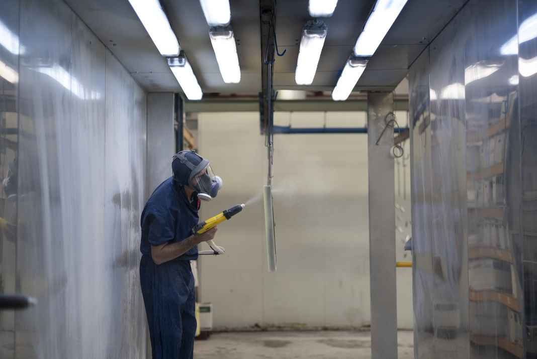 Craftsman paiting a metal structure