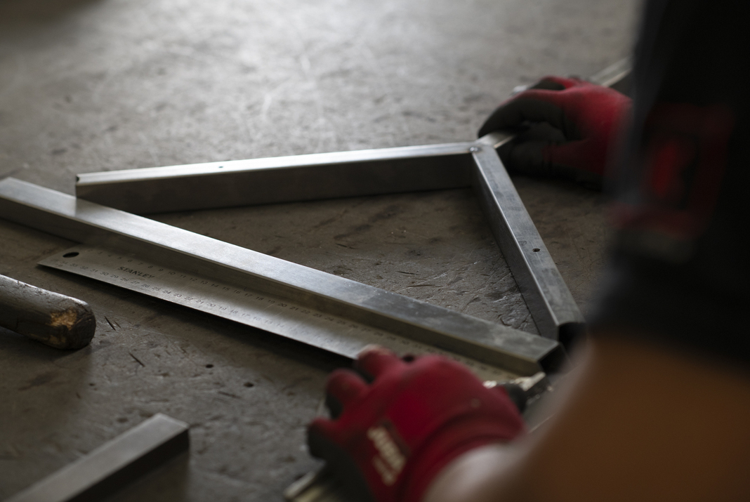 Craftsman working on metal structure