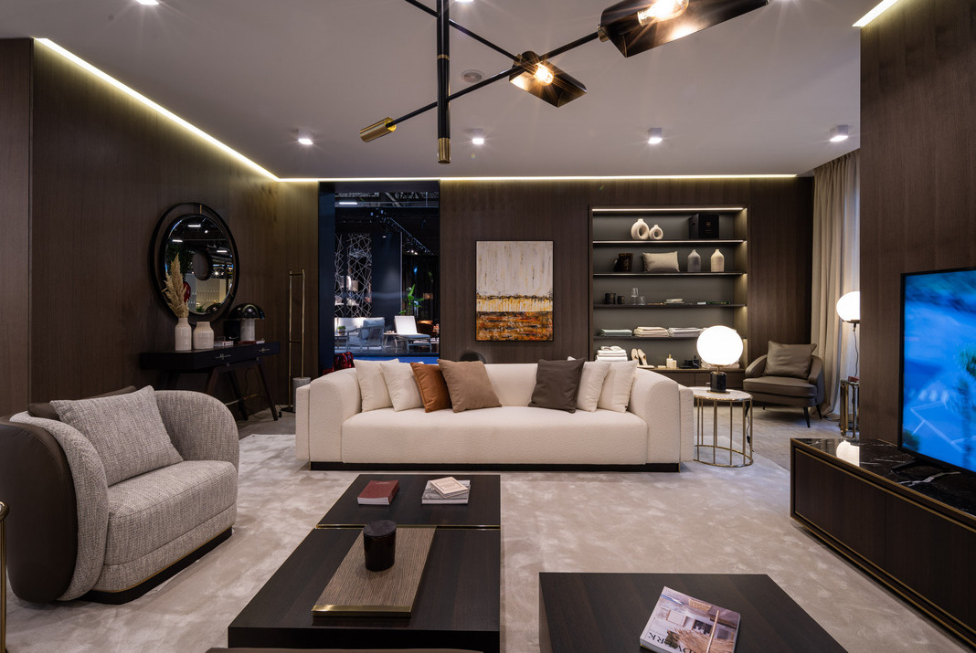 Living room with a beige sofa, a grey armchair, a coffee table and a tv cabinet.