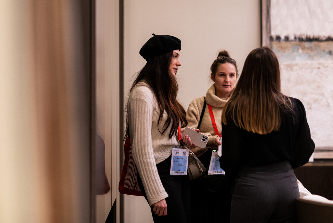 Visitors talking at interior design trade show