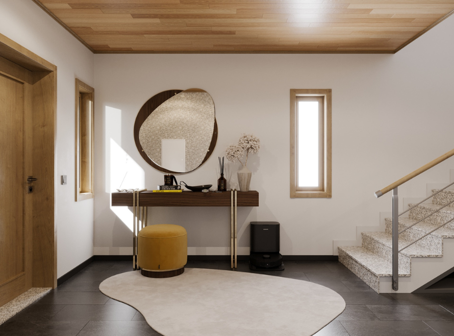 Hall de entrada con consola en nogal y patas doradas, espejo orgánico circular en marco de madera, techo en madera natural y alfombra de forma irregular, proyecto Laskasas
