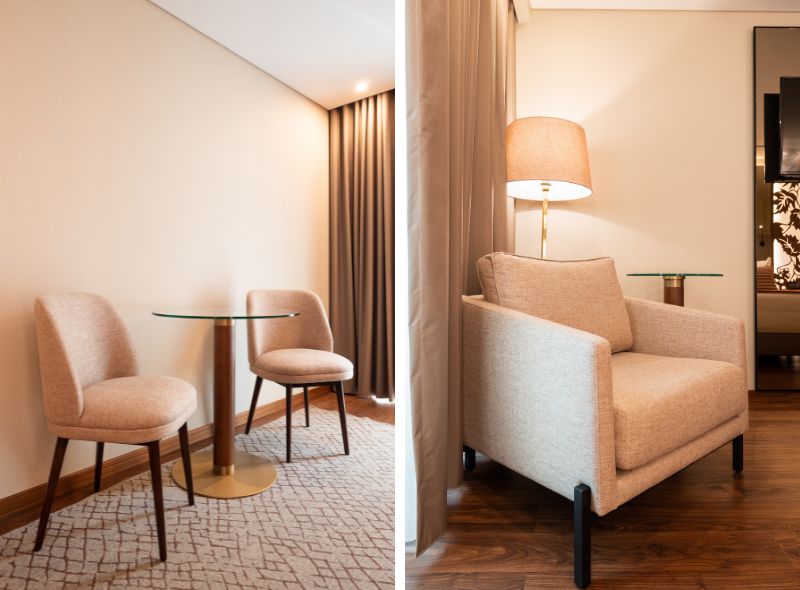 Cadeiras, mesas e cadeiro num quarto no Hotel Turim OPorto