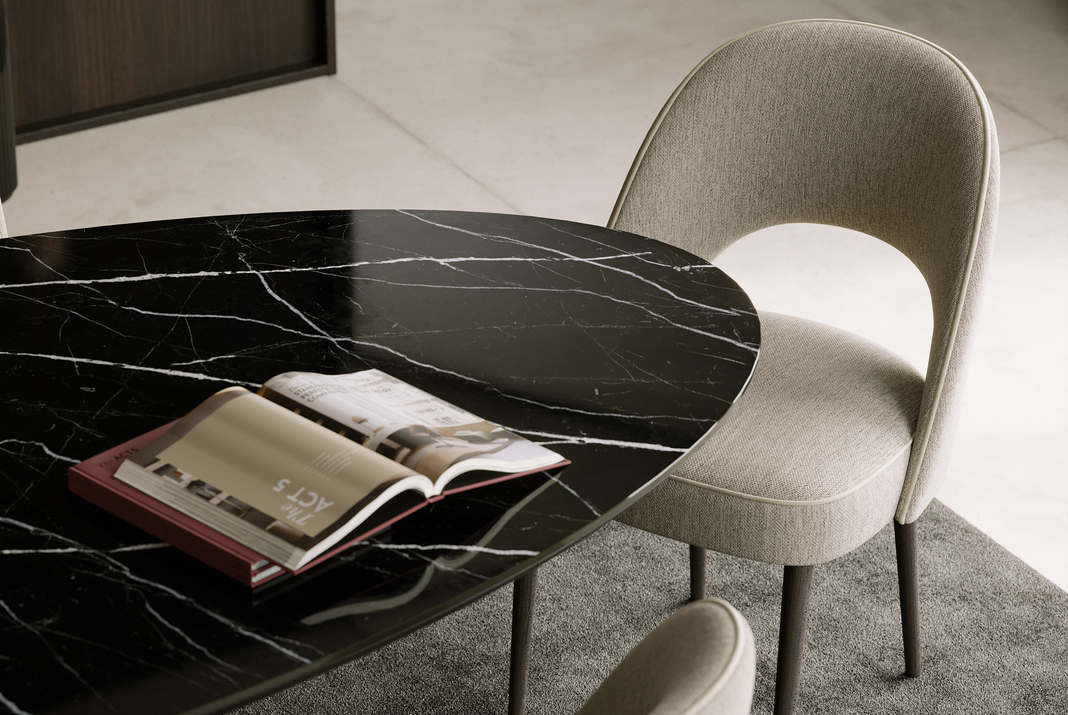 Marble dining table alongside Laskasas Catalogue and beige chairs.