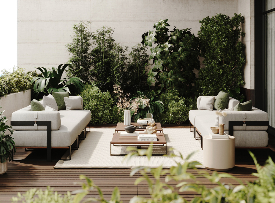 An outdoor terrace with wooden decking, two linear profile sofas, low coffee tables, and a lush green wall.