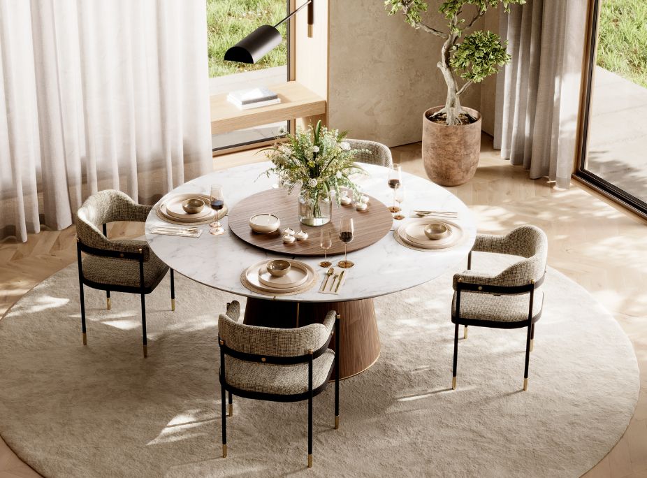 A round dining table with a marble top and a wooden centre, surrounded by textured upholstered chairs near a large window.