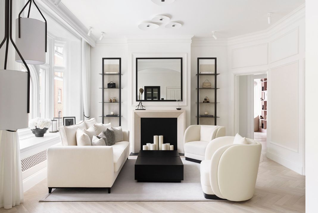Well-designed room with the Ambrose Armchair and London Sofa in Matte Black Ash and Lohan Nacre fabric upholstery